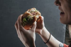 person enjoying a sandwich