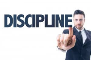 man pointing to discipline sign