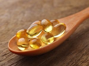 Fish oil capsules in a spoon omad diet