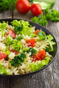 Pasta salad with cherry tomatoes and broccoli, selective focus