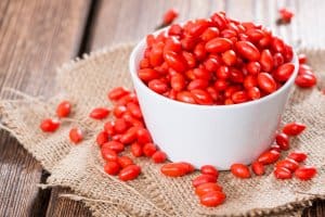 Some fresh Goji Berries (also known as Wolfberry) on vintage wooden background