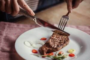 a plate with a fork knife and fork