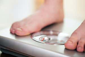 person standing on a weight scale