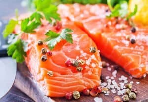 Salmon on wood cutting board