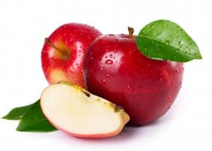 fresh red apples with leaves isolated on white background