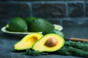 fresh avocado on a table, green avocado