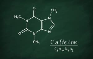 Chemical formula of Caffeine on a blackboard