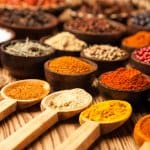 Spices and herbs in wooden bowls. Food and cuisine ingredients.