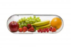 Different fruit in capsule - healthy diet concept