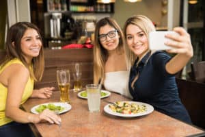 girls taking a dinner time selfie